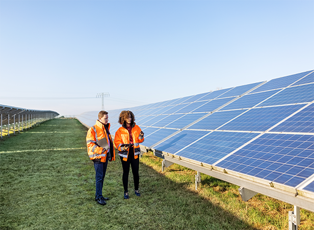 workers outside near solar panels