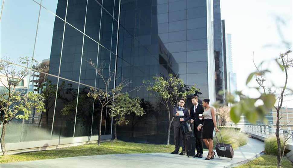 business people outside building
