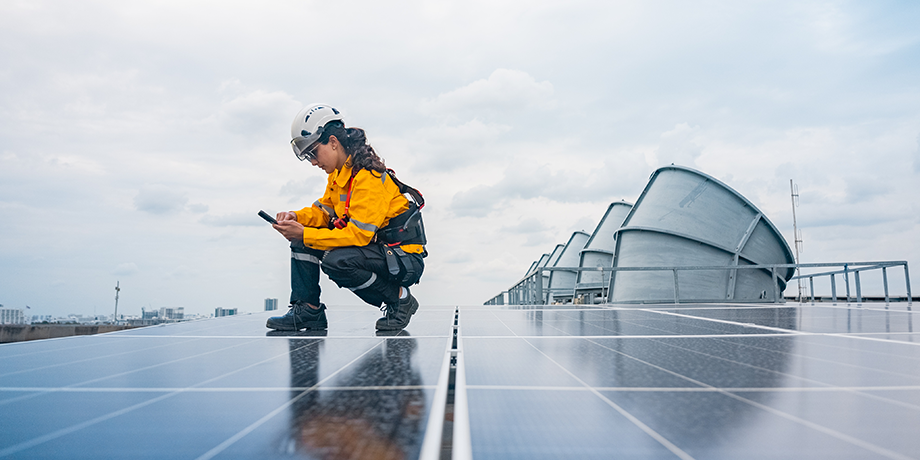 worker on solar panels