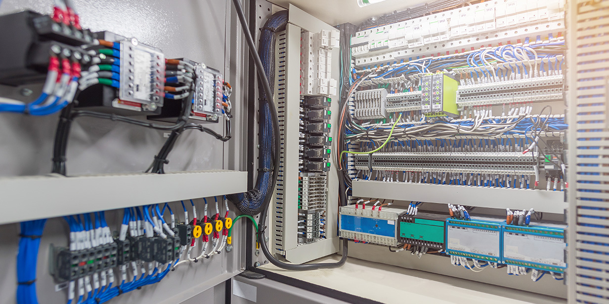 industrial electrical panel with circuit breakers and wiring for power distribution
