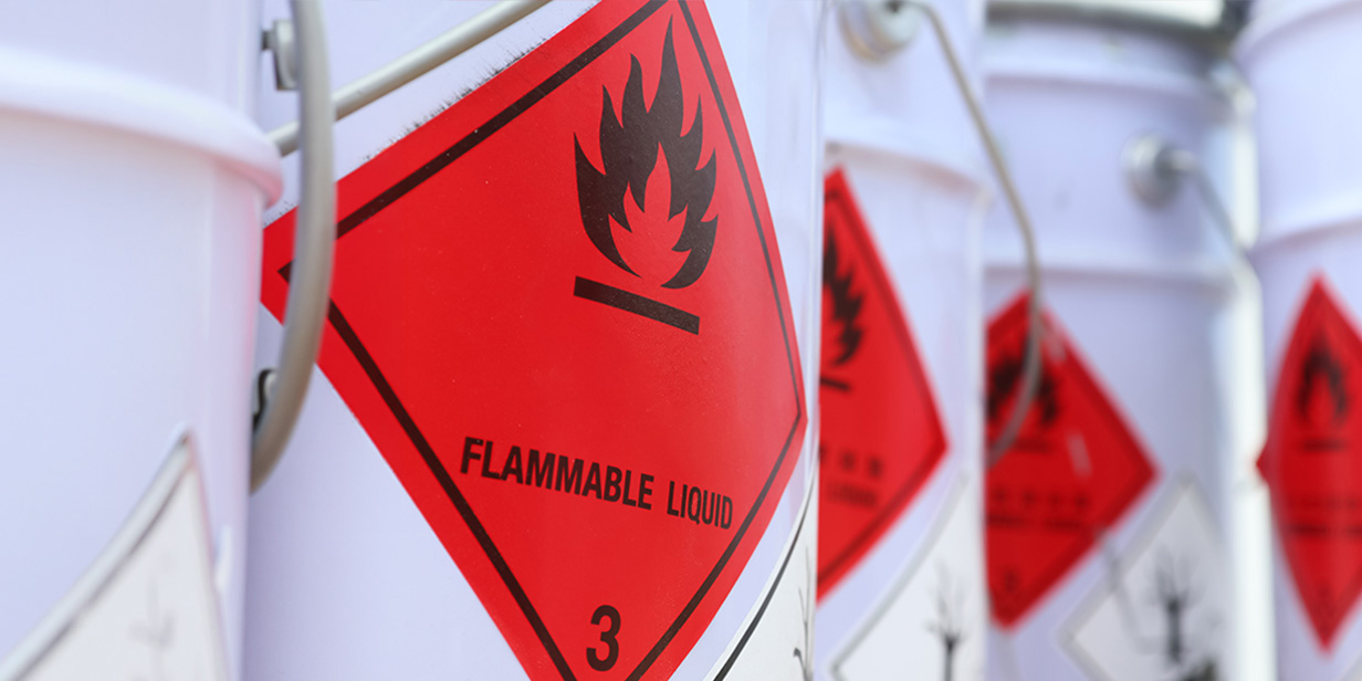 flammable liquid containers with hazard labels for ignitable liquid storage and fire risk prevention