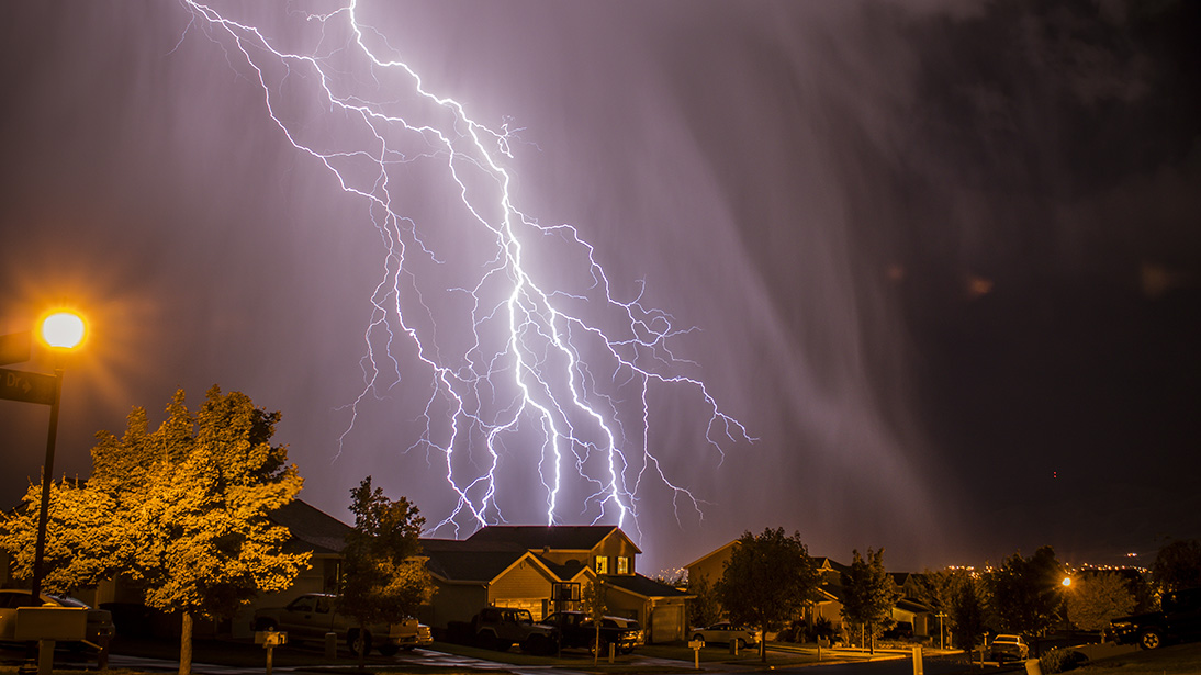 lightning bolts over neighborhood