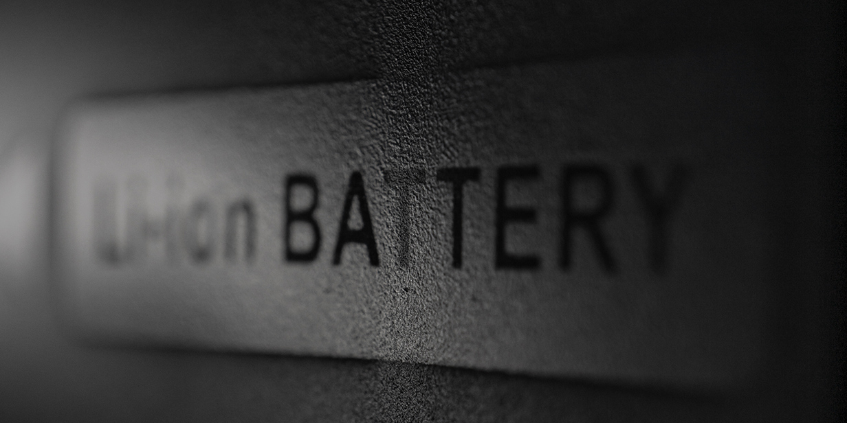 close-up of a lithium-ion battery label on equipment, highlighting Li-ion battery technology and potential battery safety risks