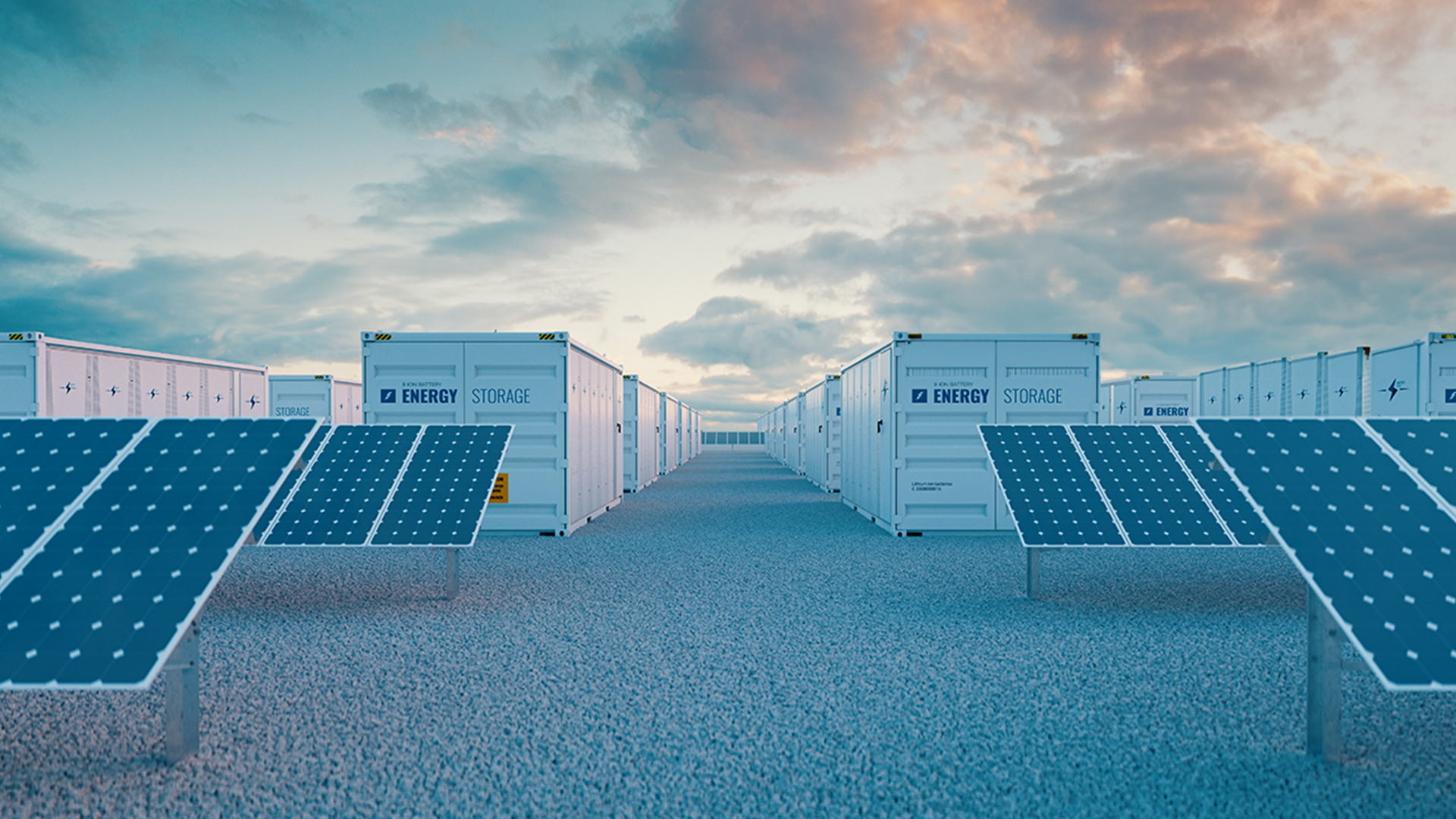 lithium-ion battery energy storage containers paired with ground-mounted solar panels at a renewable energy facility