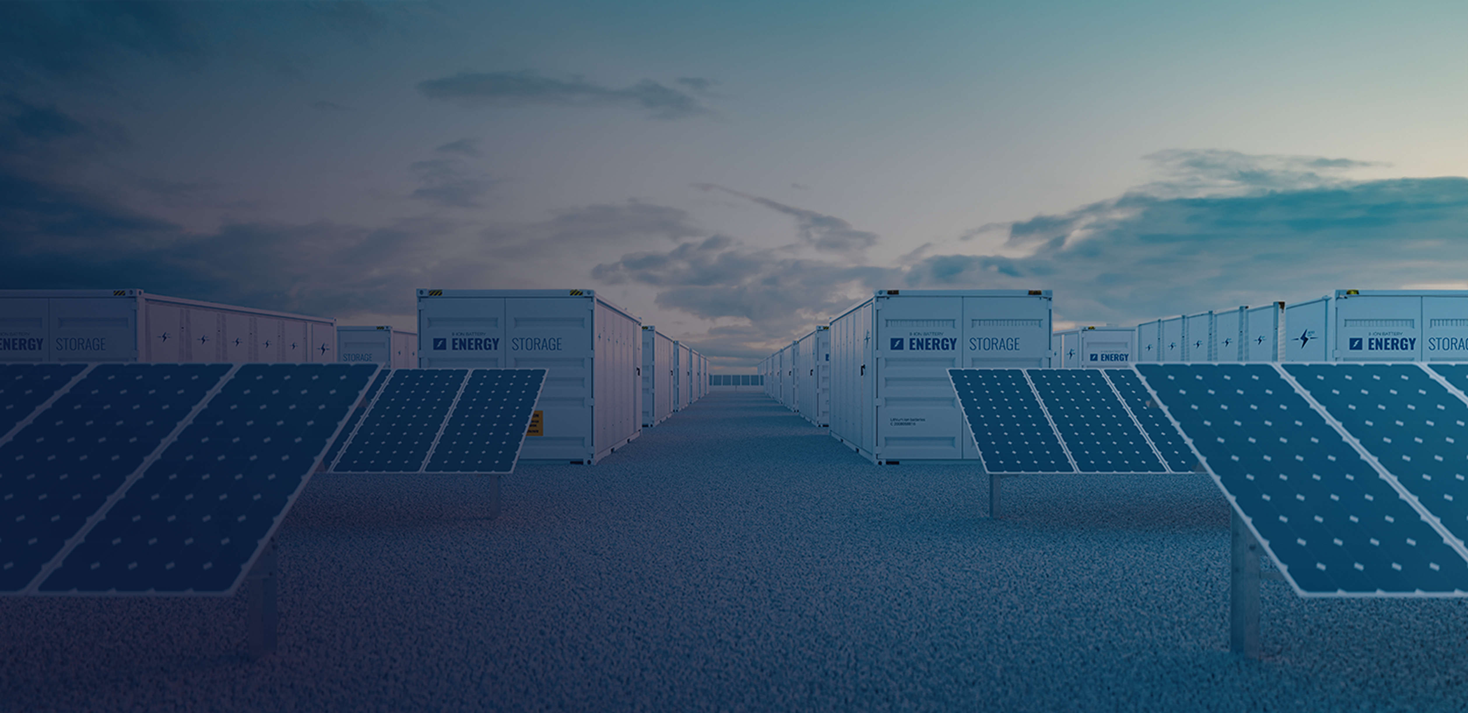 solar panels and energy storage containers at a renewable energy facility under a cloudy sky