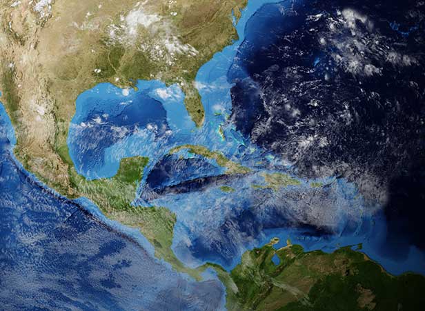 satellite view of the Americas with clouds and water bodies