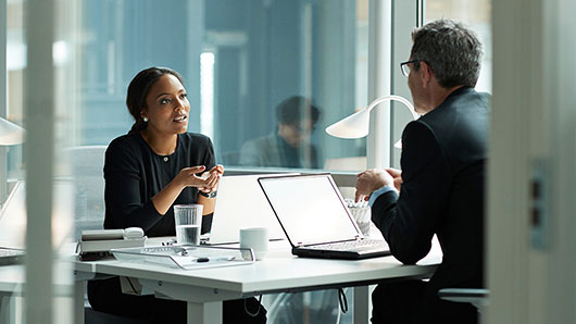 Two people in a meeting